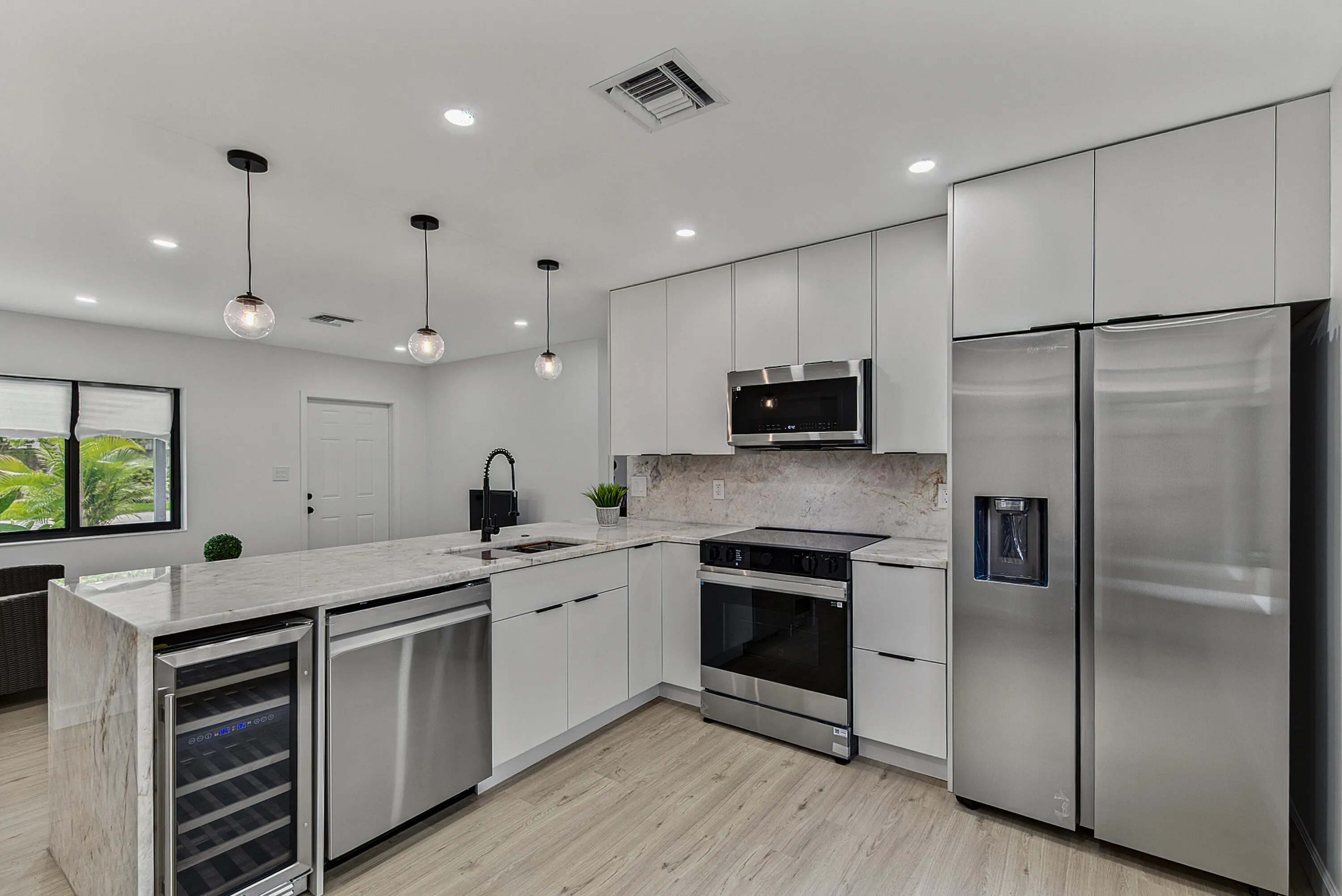 Beautiful kitchen with top of the line appliances and Cristallo counters