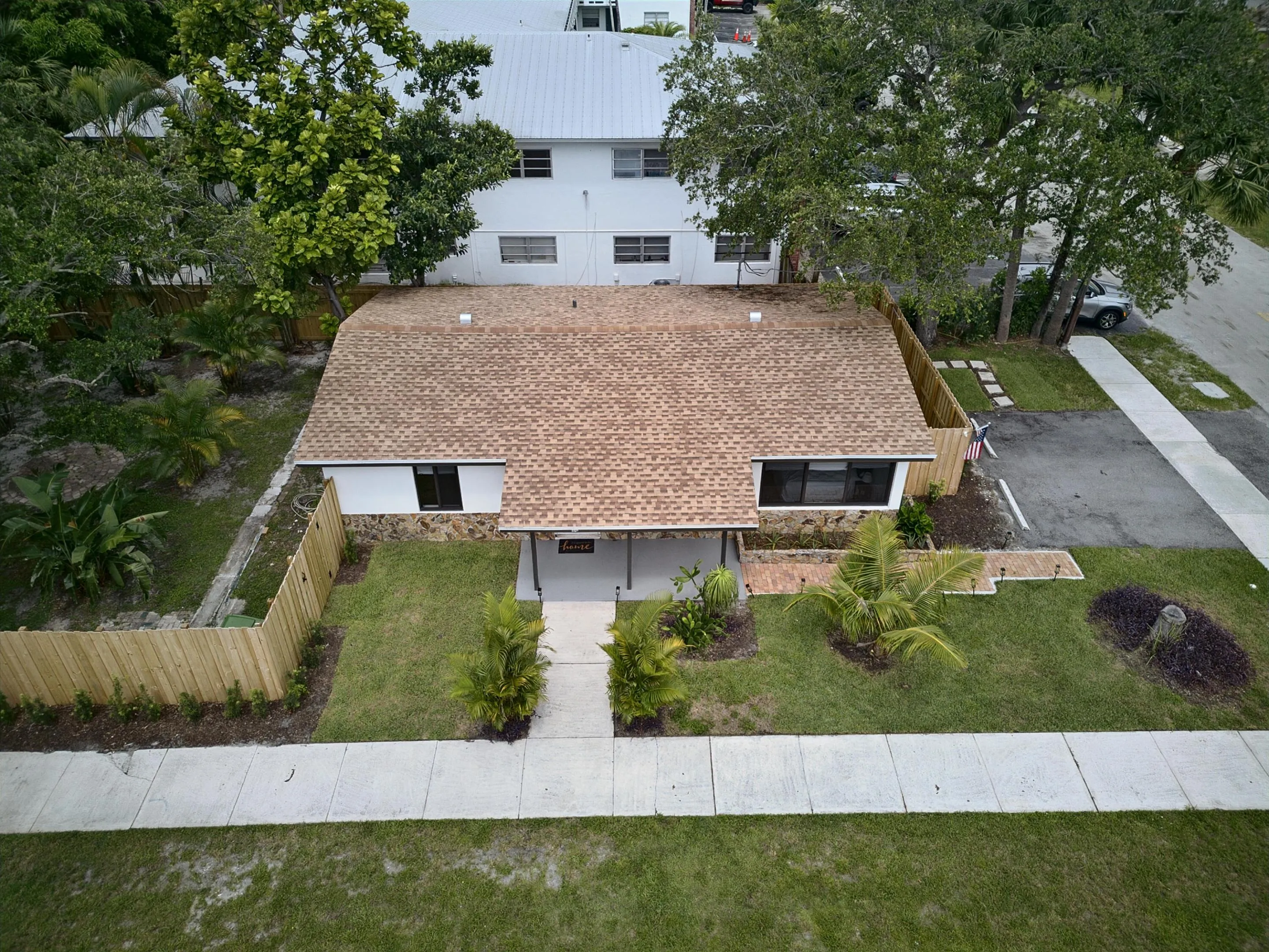 Aerial view of home featuring new roof and new fence