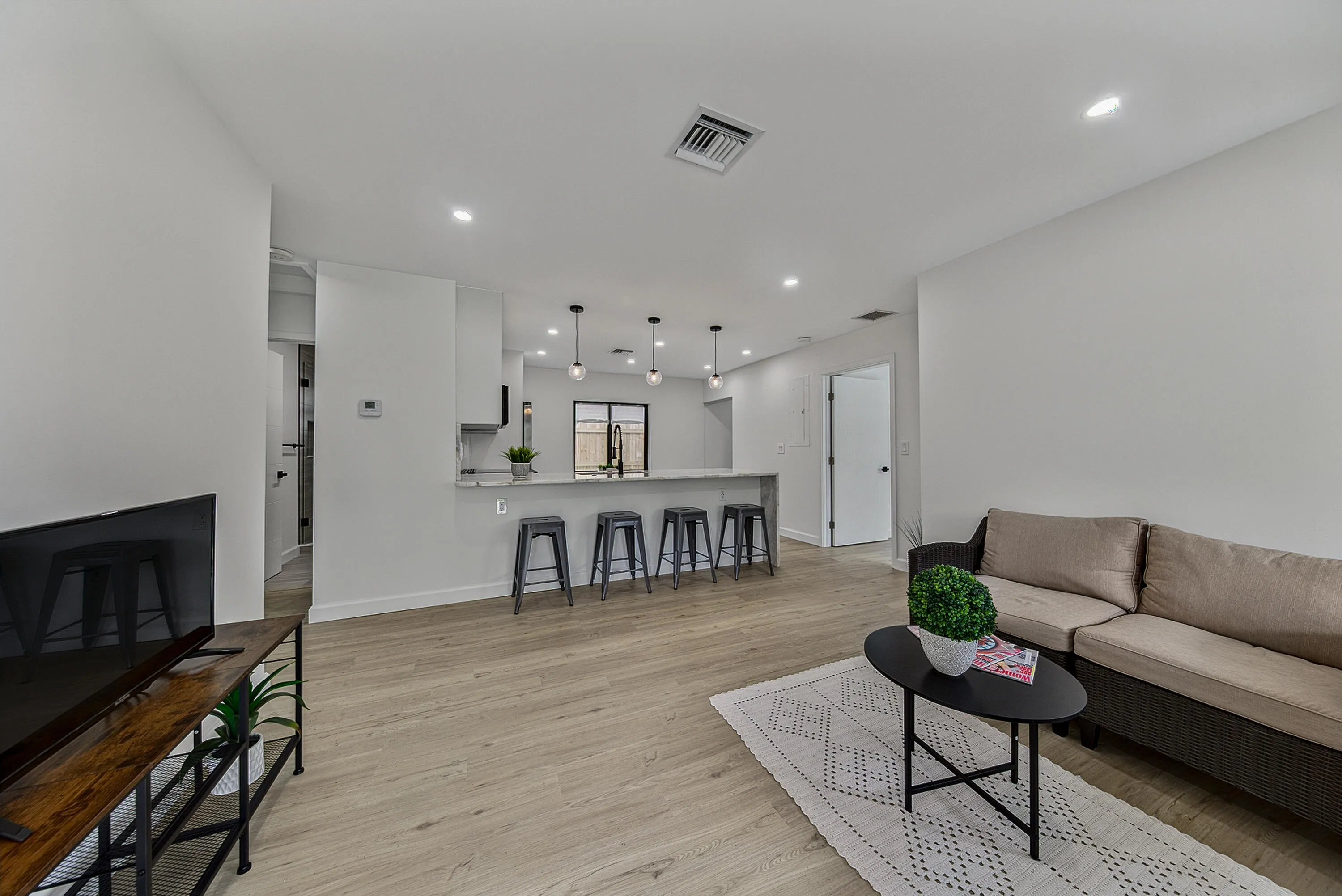 Living room with view into the kitchen
