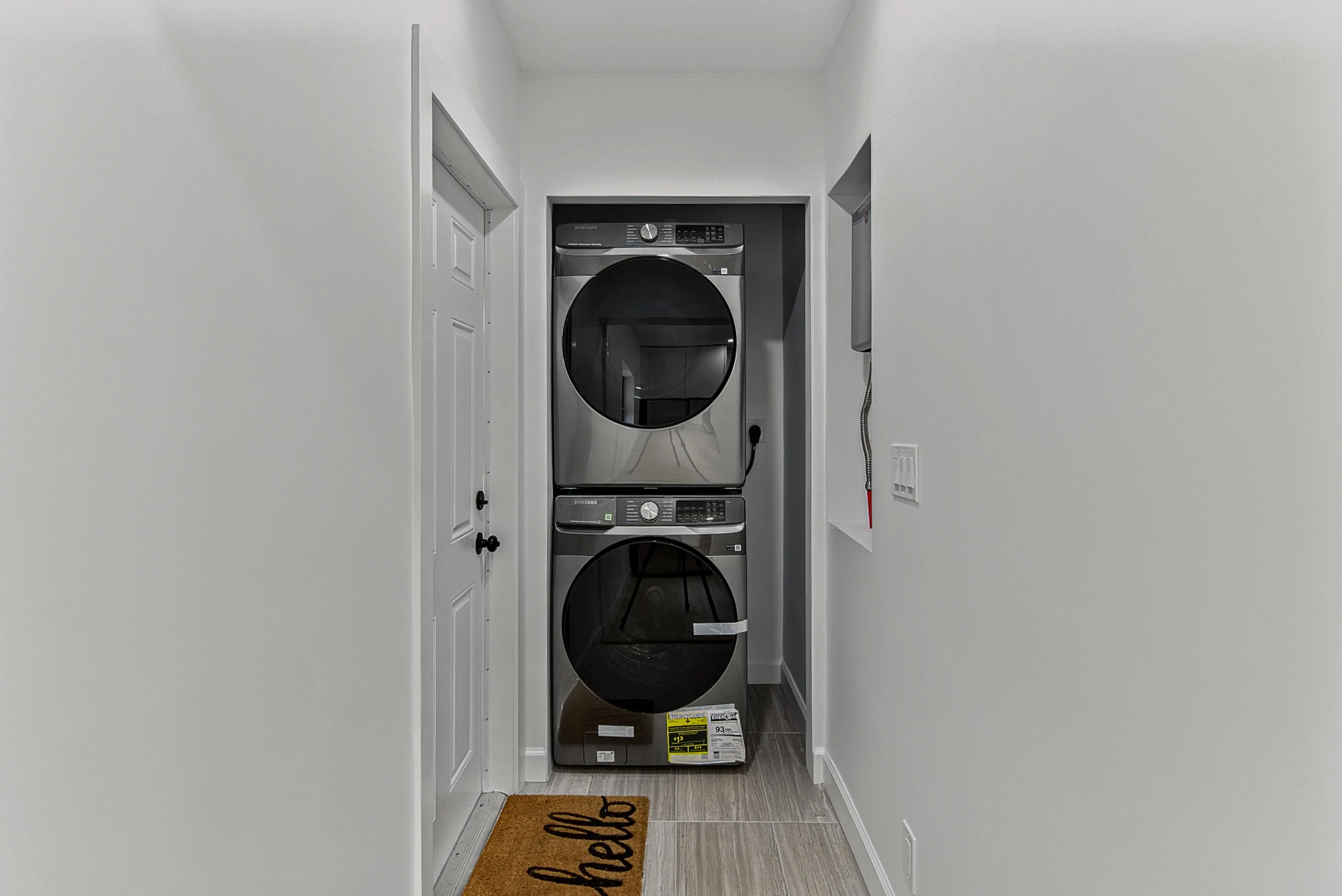 Laundry room/area accommodates full sized stacked washer/dryer. Washer/dryer shown for staging only and do not convey.