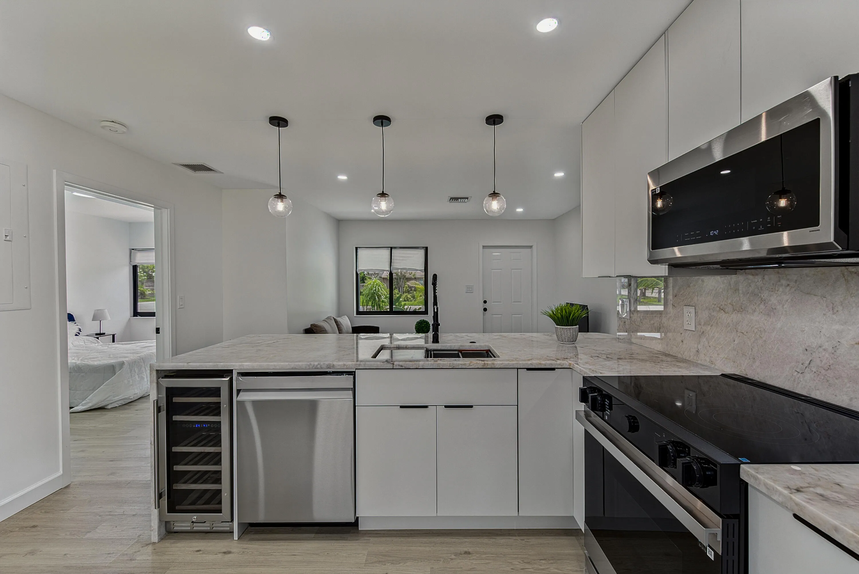 Kitchen with upgraded stainless steel Samsung appliances. Noce wine fridge.