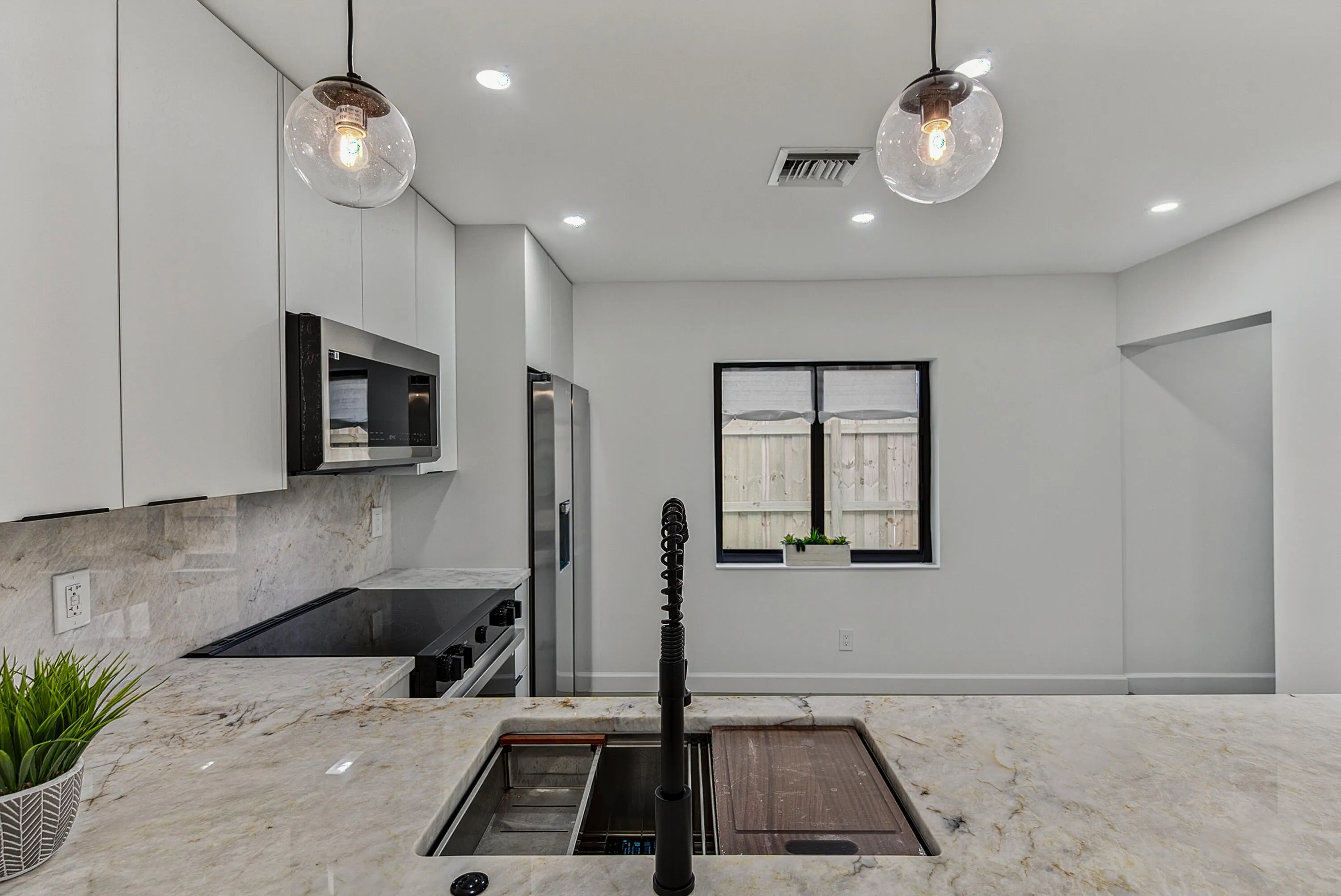 Close up of Cristalo counters and besitful sink and lighting