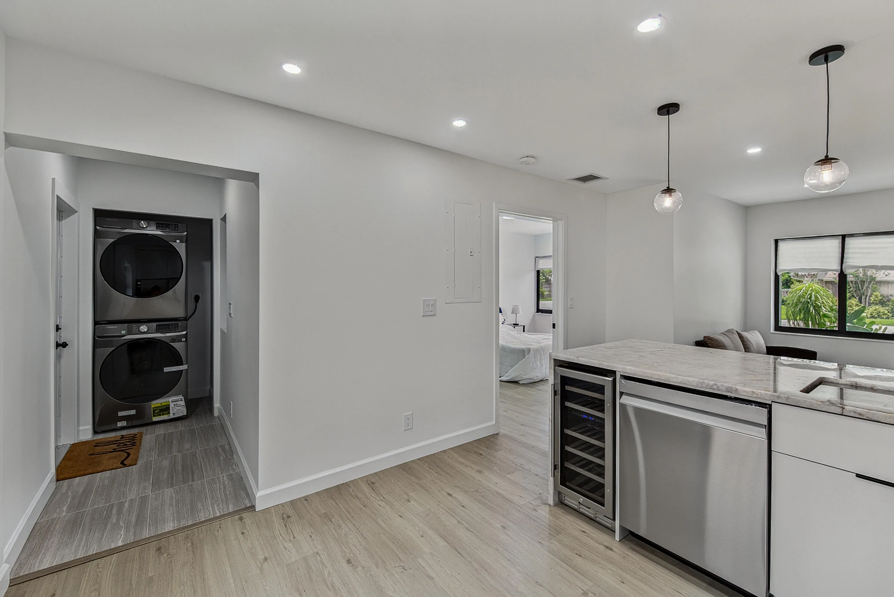 View of laundry room/area from kitchen. Washer/dryer for staging and do not convey.