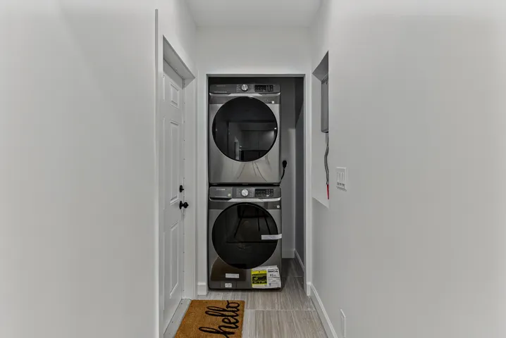 Laundry room/area accommodates full sized stacked washer/dryer. Washer/dryer shown for staging only and do not convey.