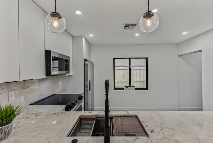 Close up of Cristalo counters and besitful sink and lighting