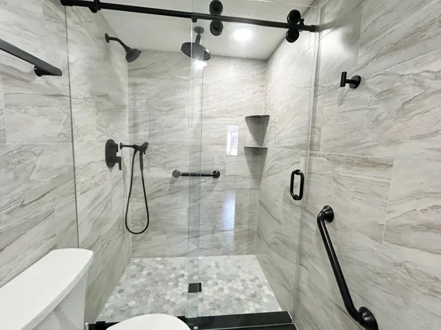 FRAMELESS BARN DOOR STYLE SHOWER DOORS