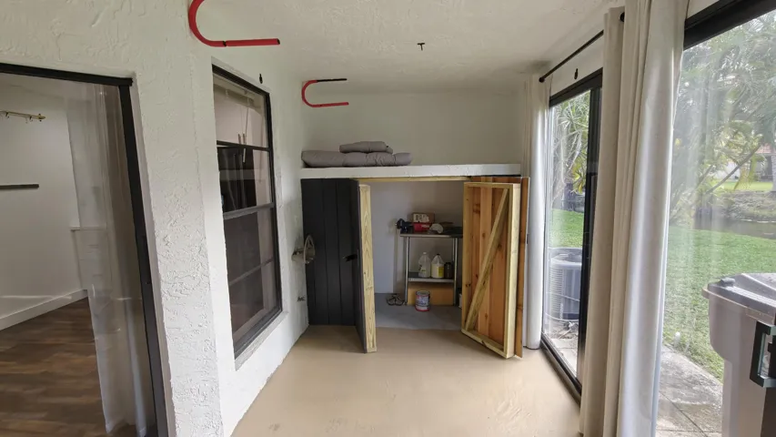 Back impact sliding door enclosed patio/ tv/ secondary bedroom- Fishing pole- surfboard rack