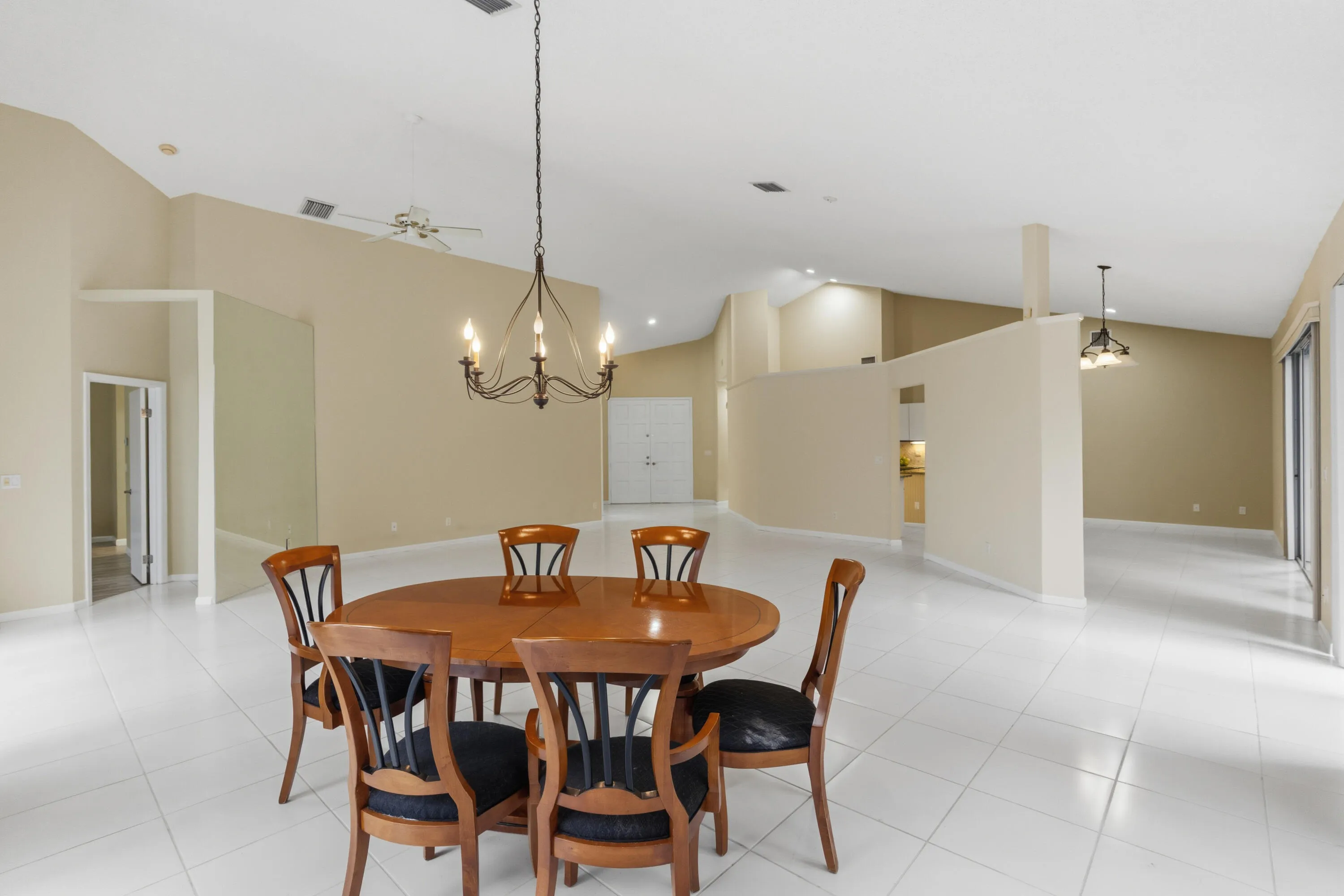 Great room with soaring ceilings and views of the pool and golf course.