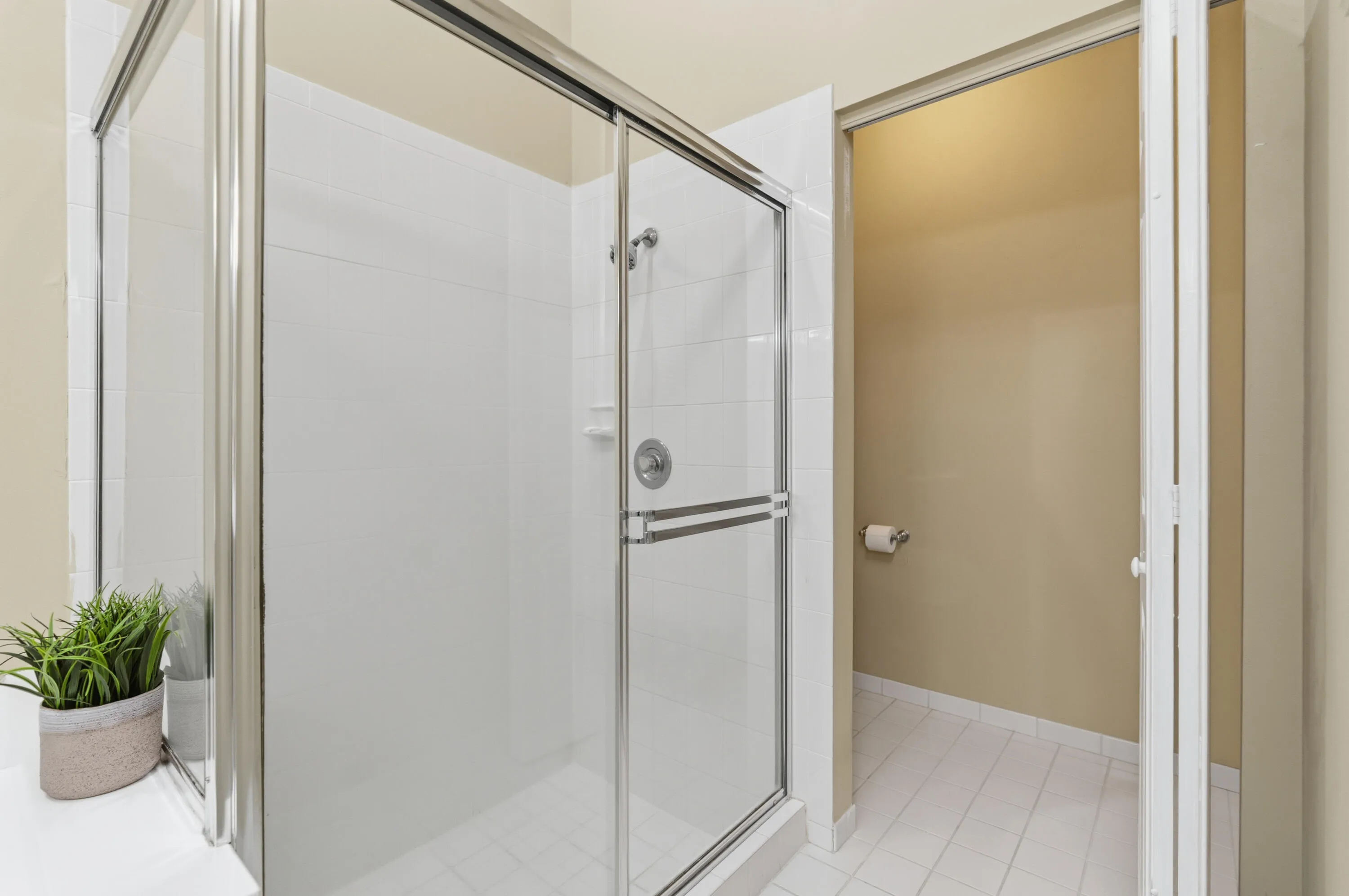 Primary bathroom has a separate tub and shower and private water closet.