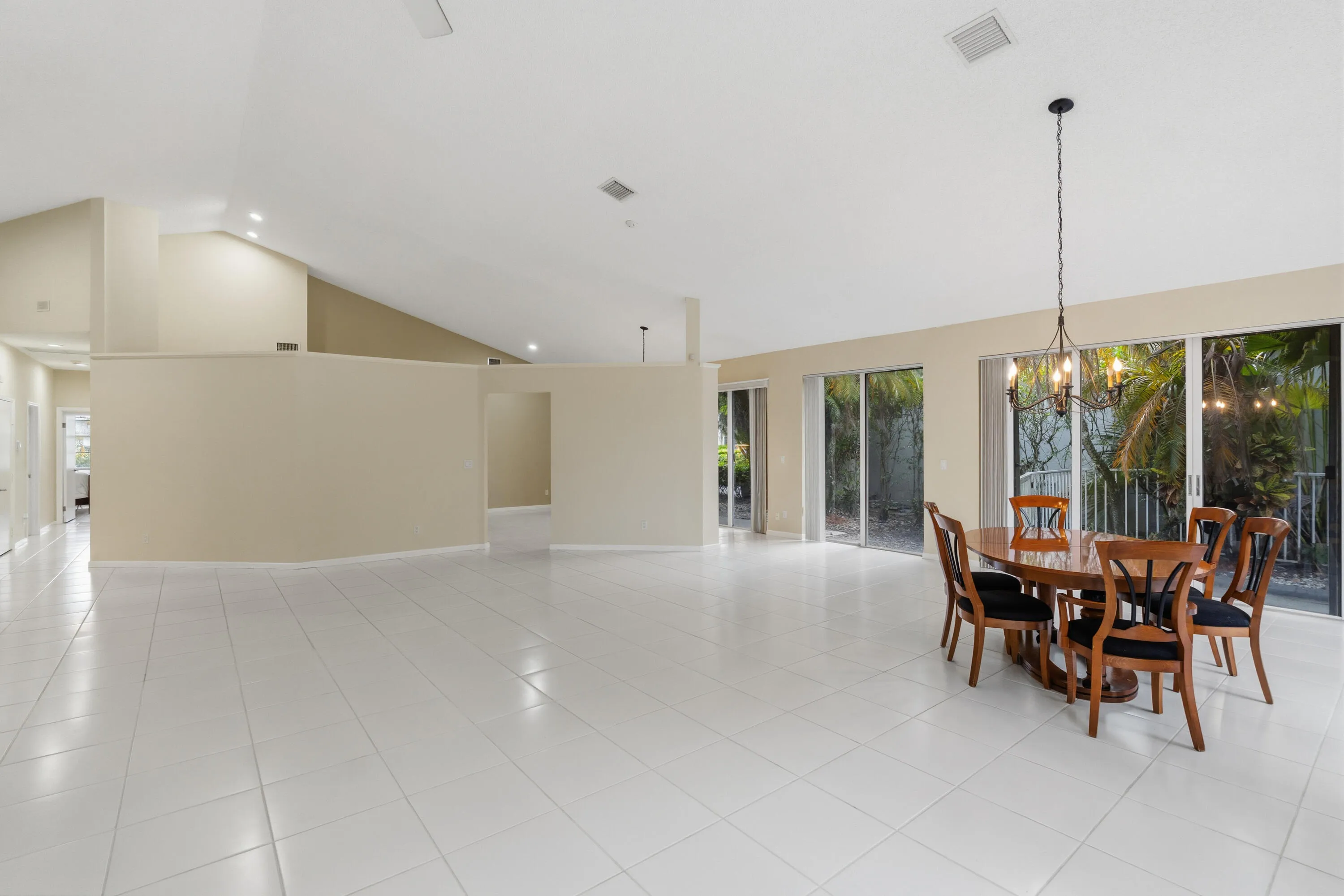 Great room with soaring ceilings and views of the pool and golf course.