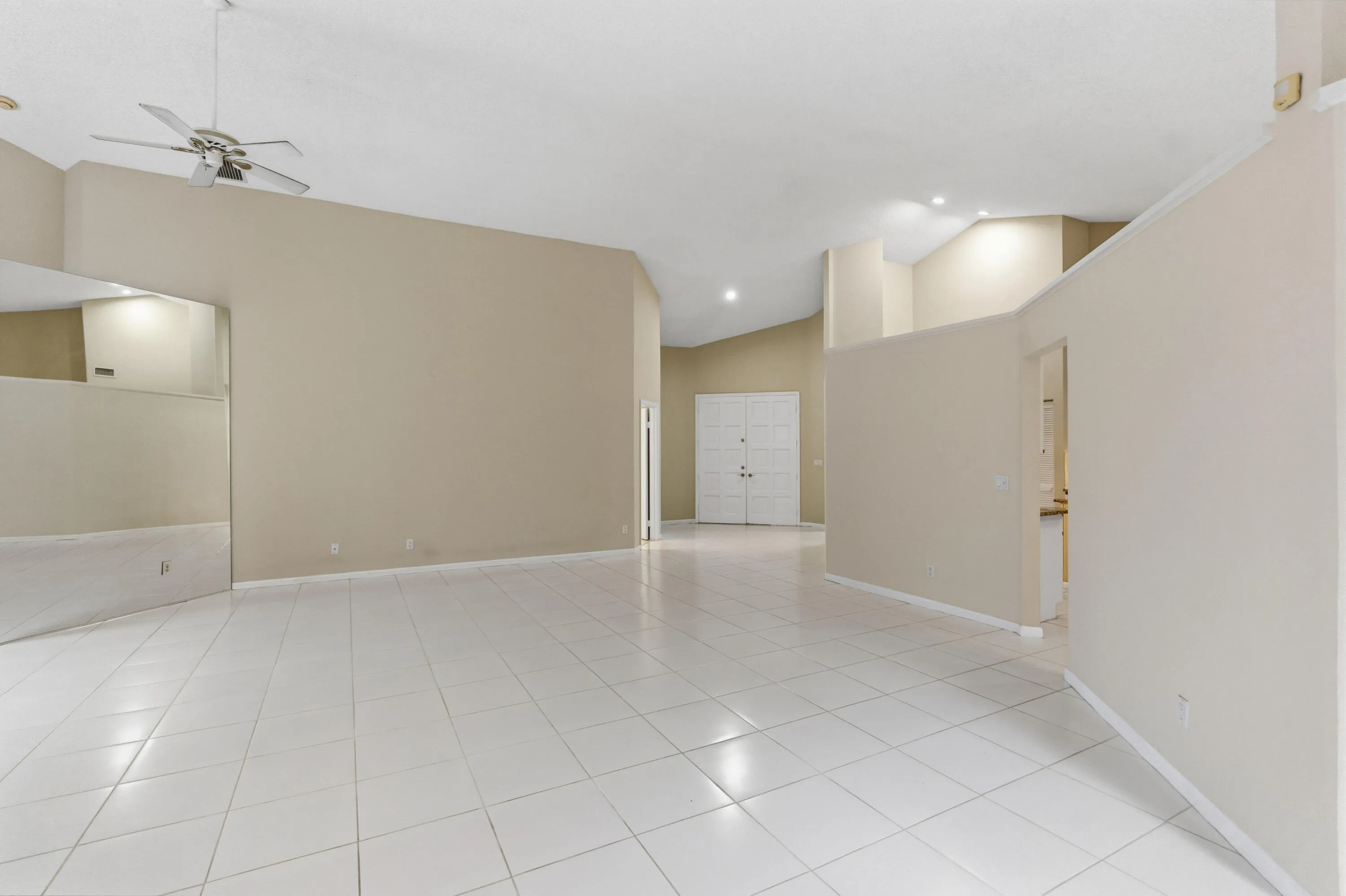 Great room with soaring ceilings and views of the pool and golf course.