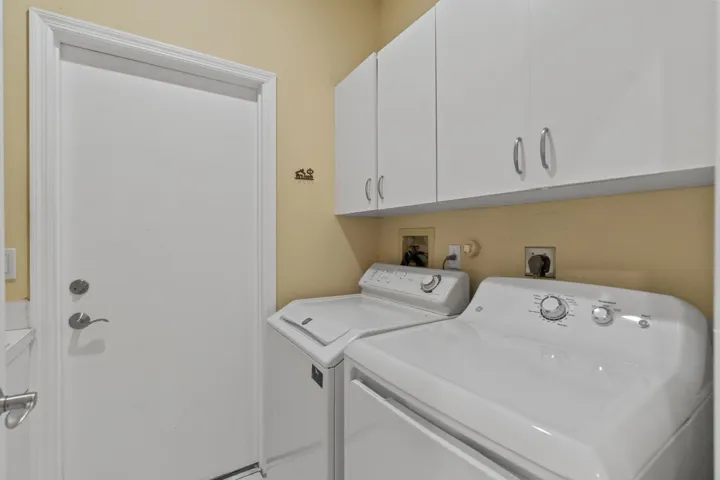 Interior laundry room also has a utility sink on the opposite wall.