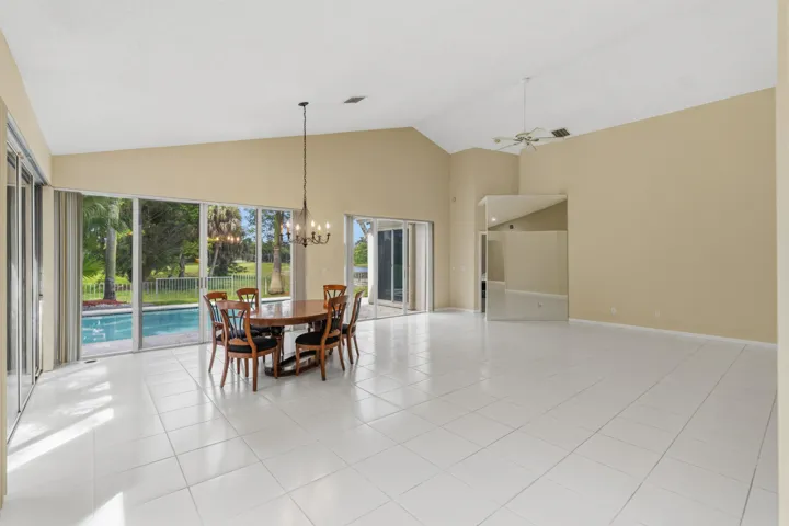 Great room with soaring ceilings and views of the pool and golf course.