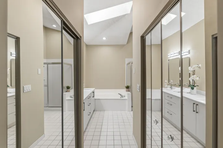 Two closets including a walk-in closet.