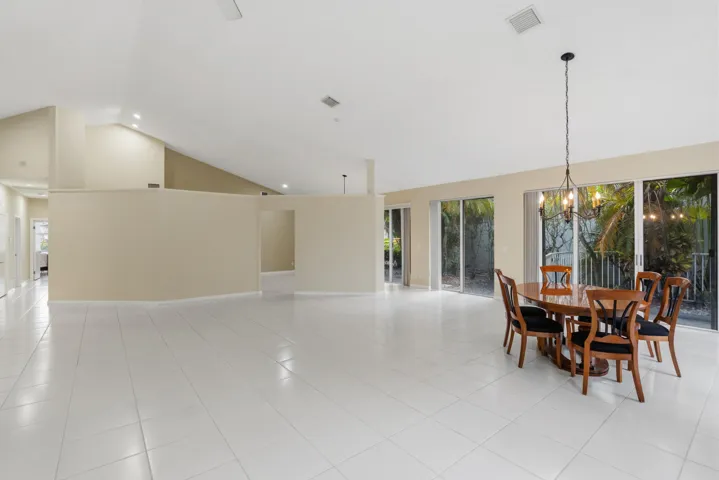 Great room with soaring ceilings and views of the pool and golf course.