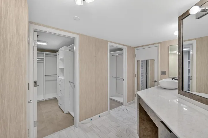 Two walk-in closets with built-in organizers