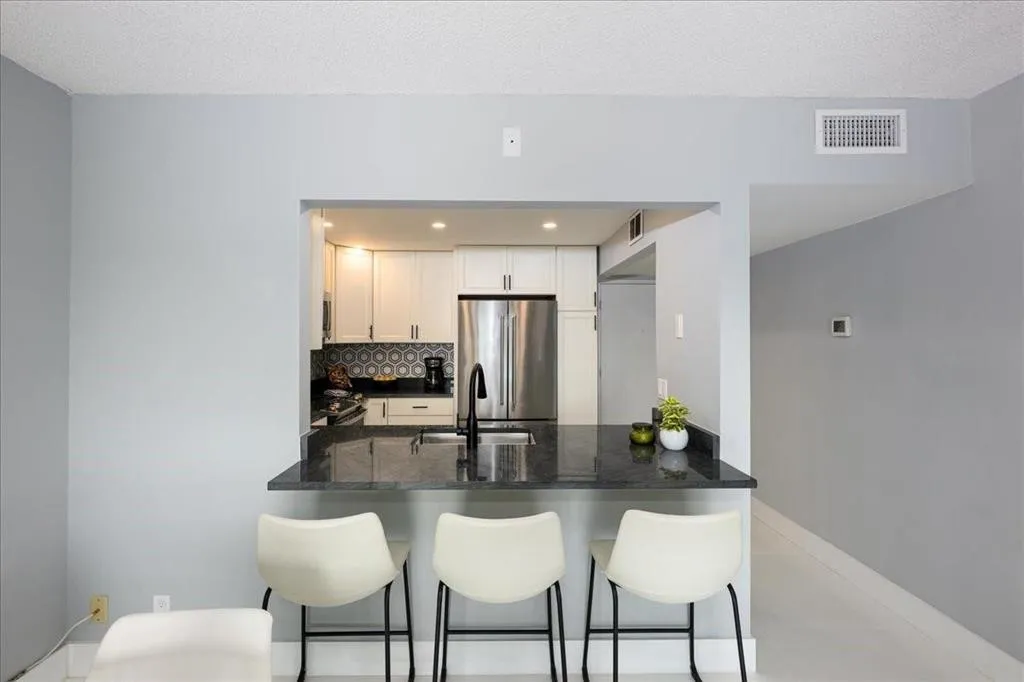 designer cabinetry with quartz countertops