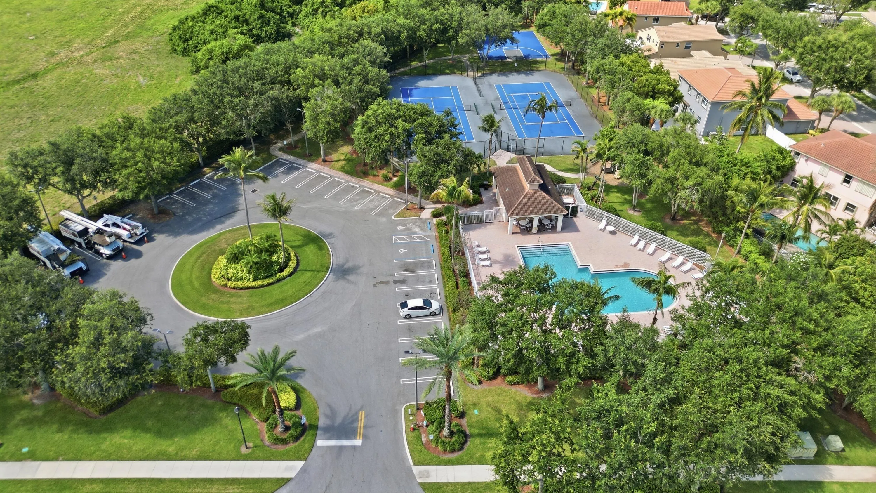 aerial view with community pool tennis and basketball courts