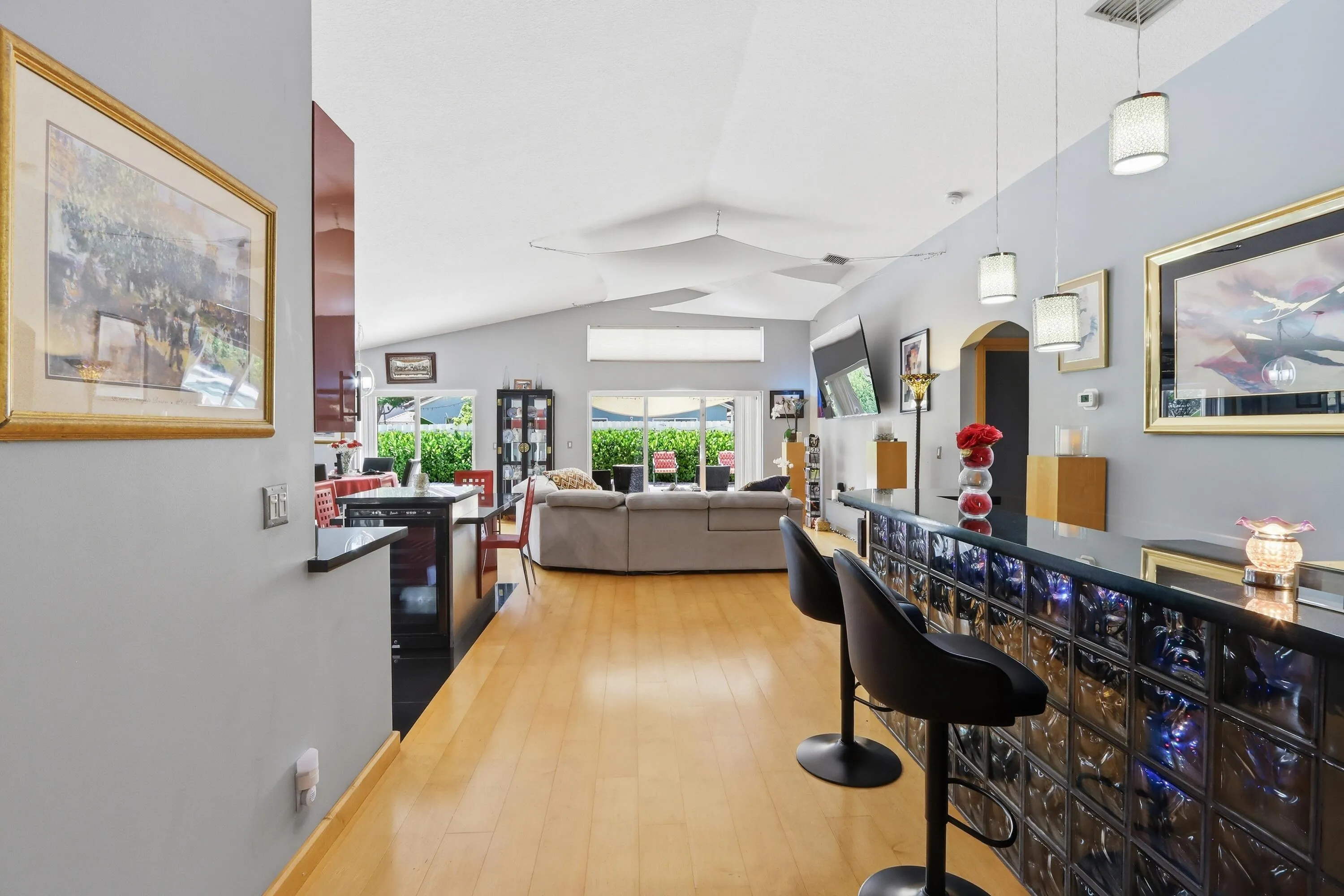 the entrance foyer leads to built in glass fronted bar