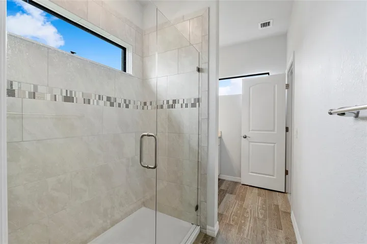Shower with Frameless Glass door.