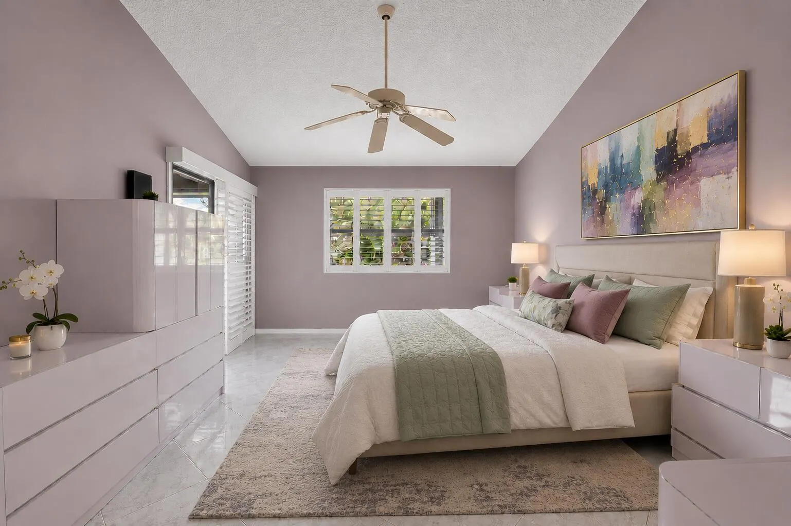 STAGED PRIMARY BEDROOM THAT OPENS TO ENCLOSED BALCONY