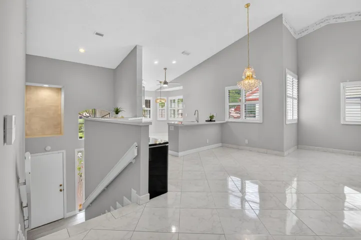 STAIRWAY UP TO DINING/LIVING AREA