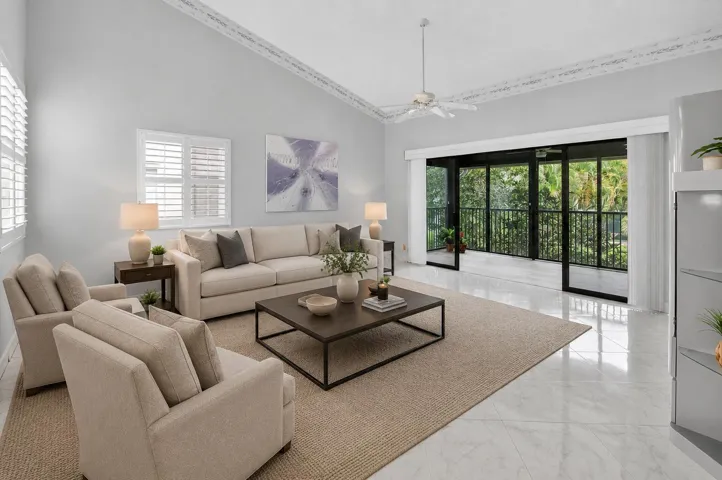 VIRTUALLY STAGED LIVING AREA THAT OPENS TO ENCLOSED BALCONY