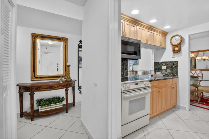 ENTRY AREA OPENING TO UPDATED KITCHEN