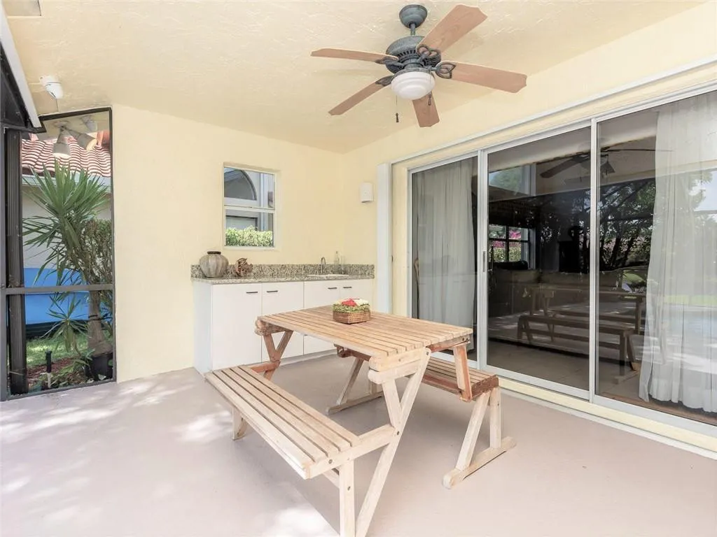 Generous covered patio (one of two areas) with granite serving station.