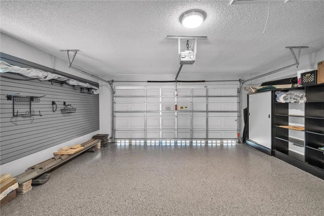 Newer epoxy flooring in the garage, July 2022! Extra storage cabs and racks too!