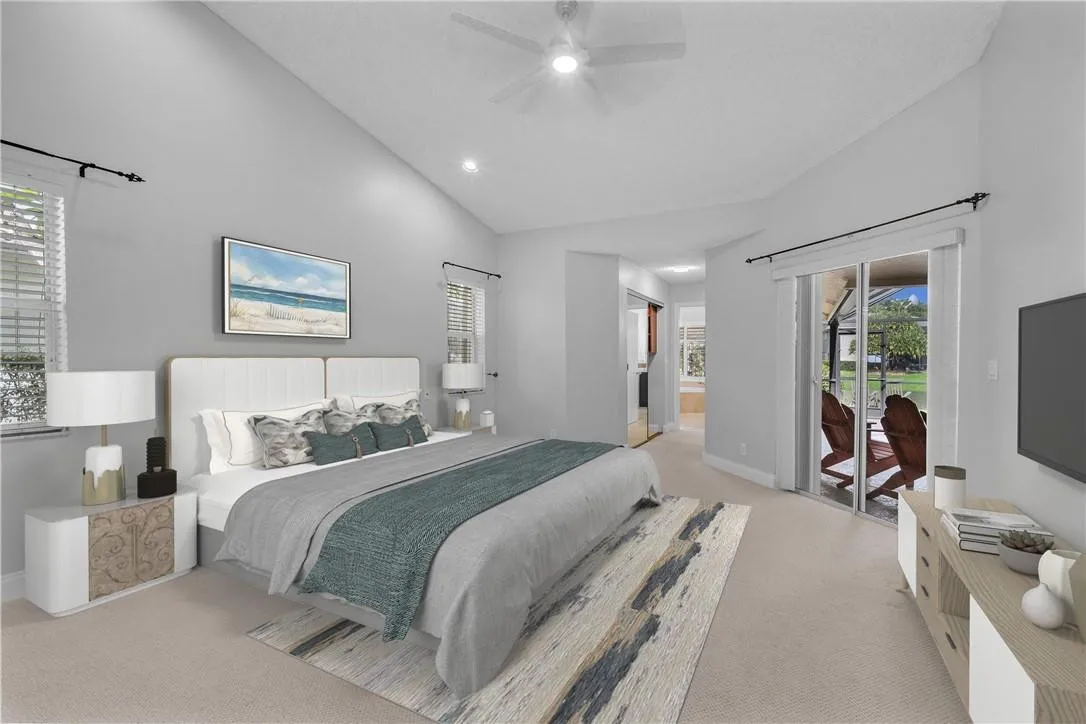 Spacious primary suite with custom walk in closets, new lighting, sliding doors to pool. Brand new ceiling fan with remote as of summer 2022.