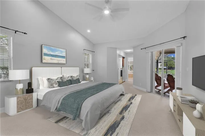 Spacious primary suite with custom walk in closets, new lighting, sliding doors to pool. Brand new ceiling fan with remote as of summer 2022.
