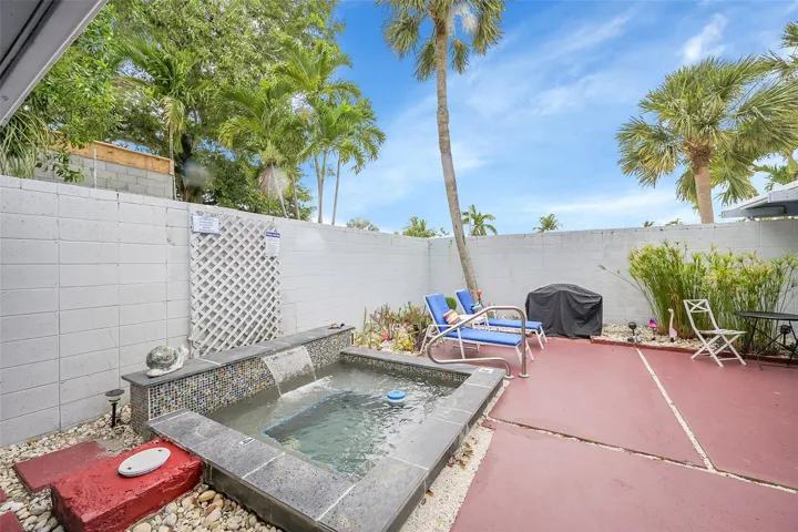 BBQ grill and table and chairs for outdoor dining!