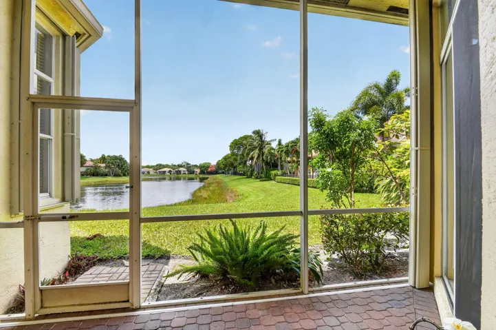 Enjoy the water view from your covered and screened patio