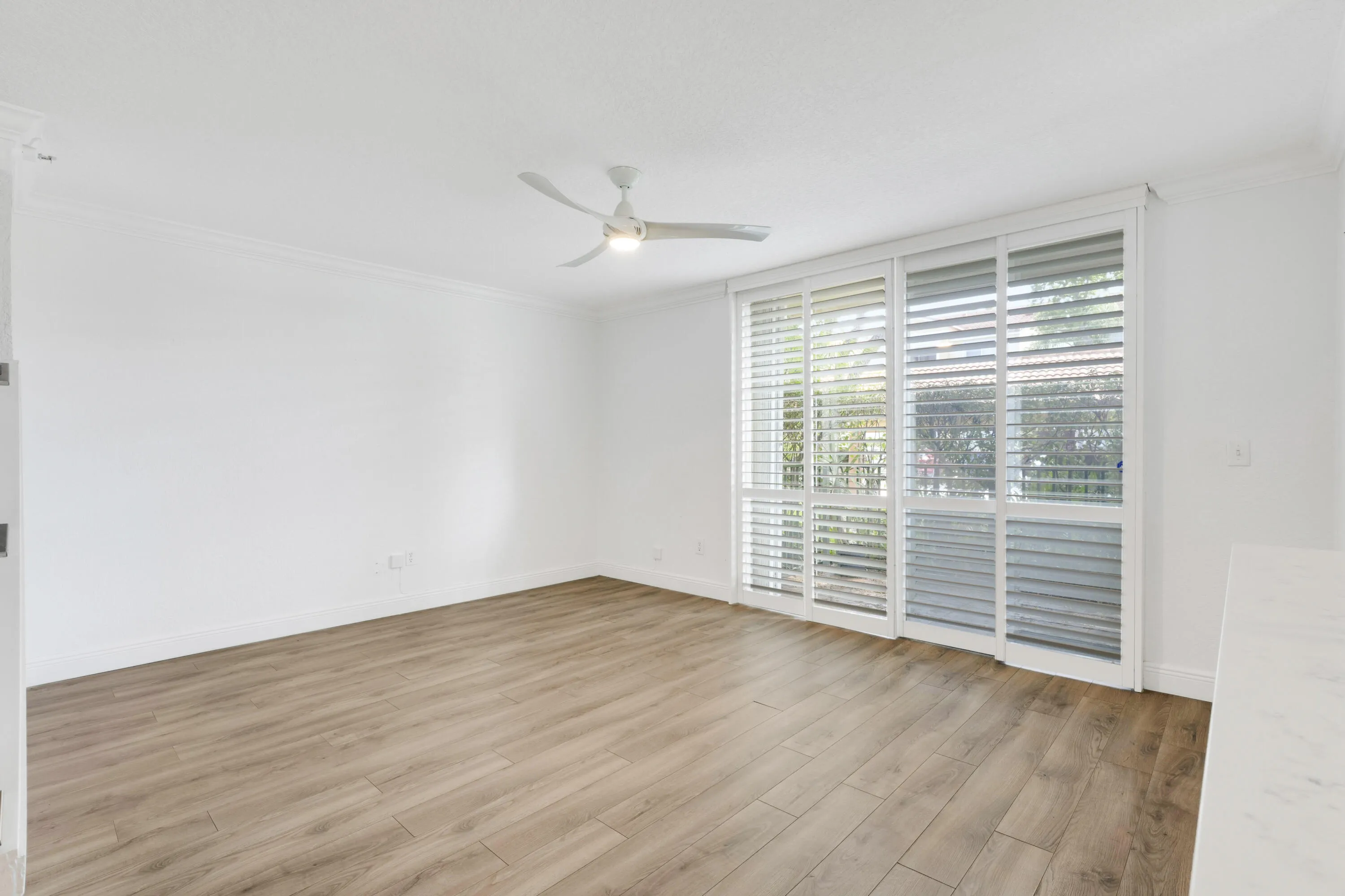 LIVING PLANTATION SHUTTERS TO PATIO