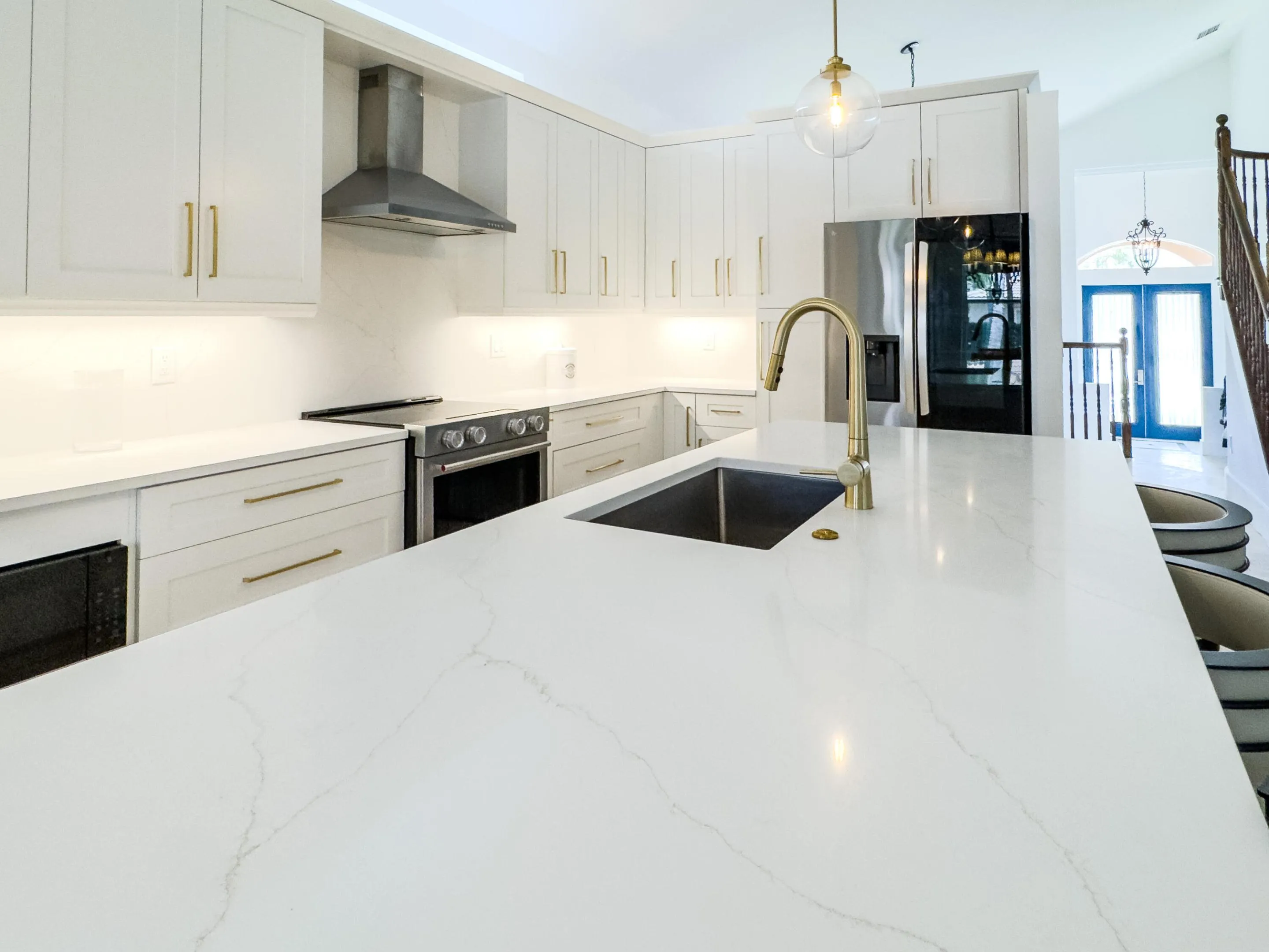 Oversized quartz topped island with bar seating