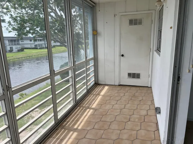 Washer and dryer in storage room on patio