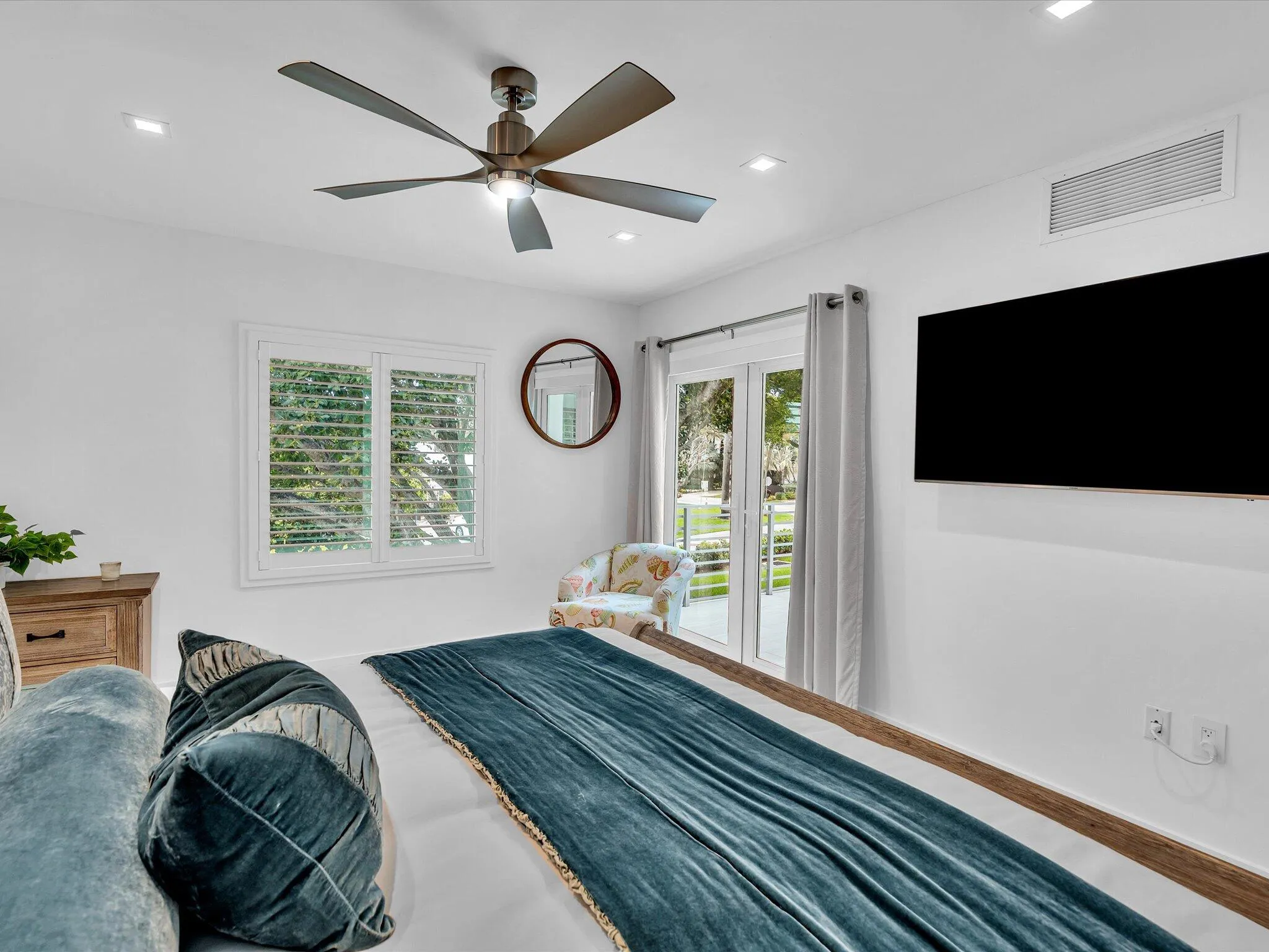 Primary bedroom, french doors leading to balcony