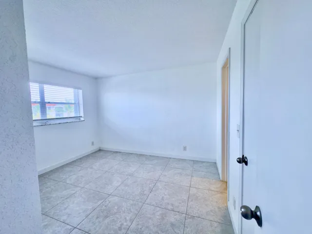 bedroom one with walk-in closet and bathroom