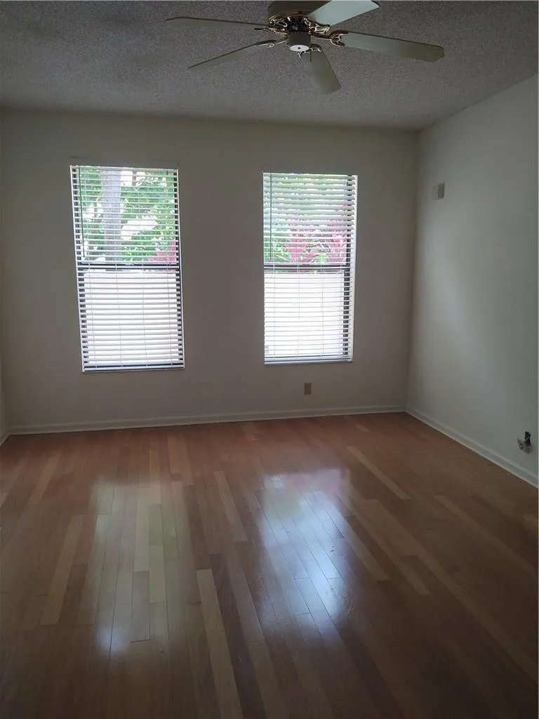 Double doors enter into guest bedroom, office or den