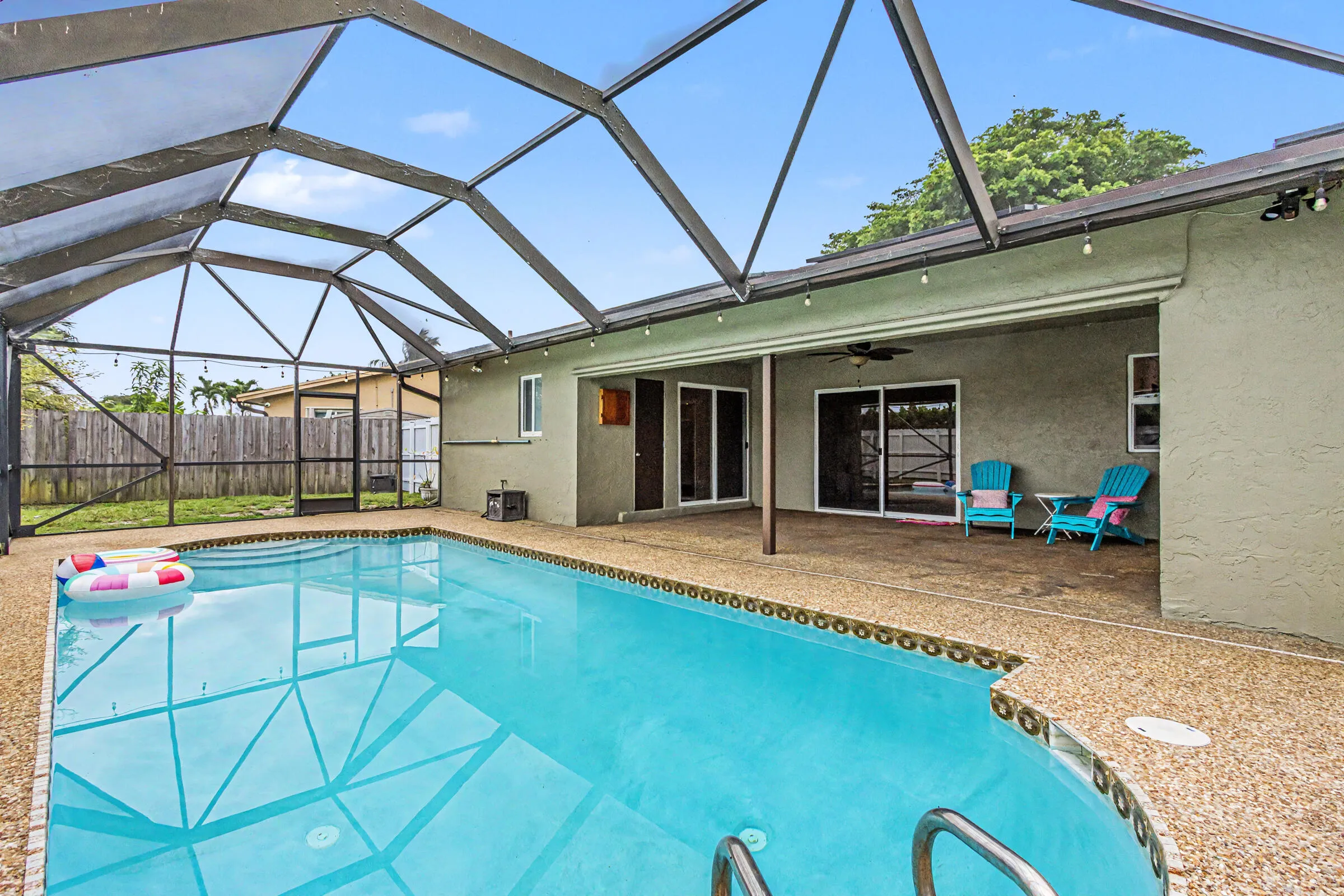 Large covered patio inside the screen enclosure
