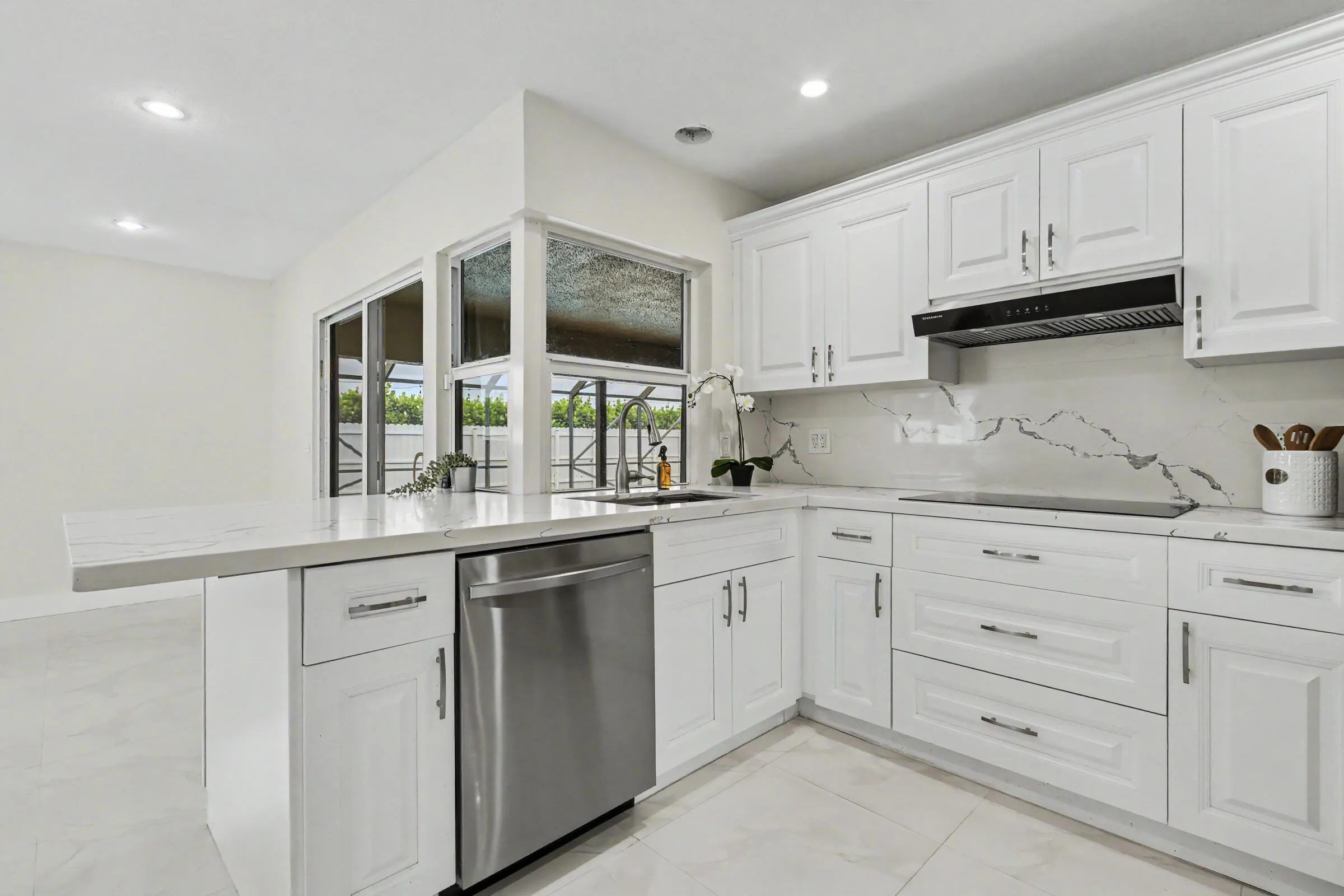 Quartz countertop bar extends into the family room