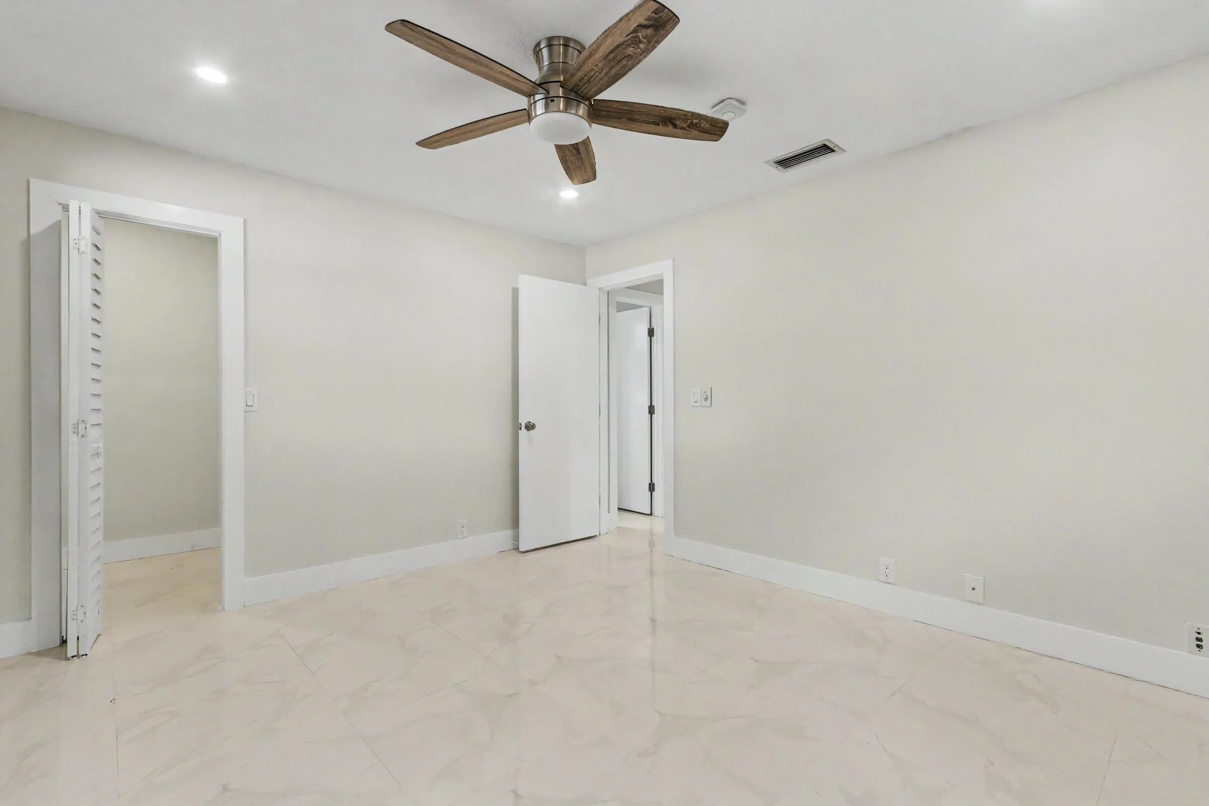 Bedroom 1 w/ a walk in closet