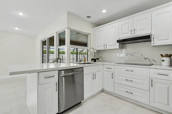 Quartz countertop bar extends into the family room