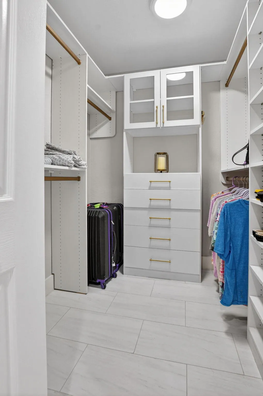 Walk-in closet #1 with buildouts-perfect for fashion fans!