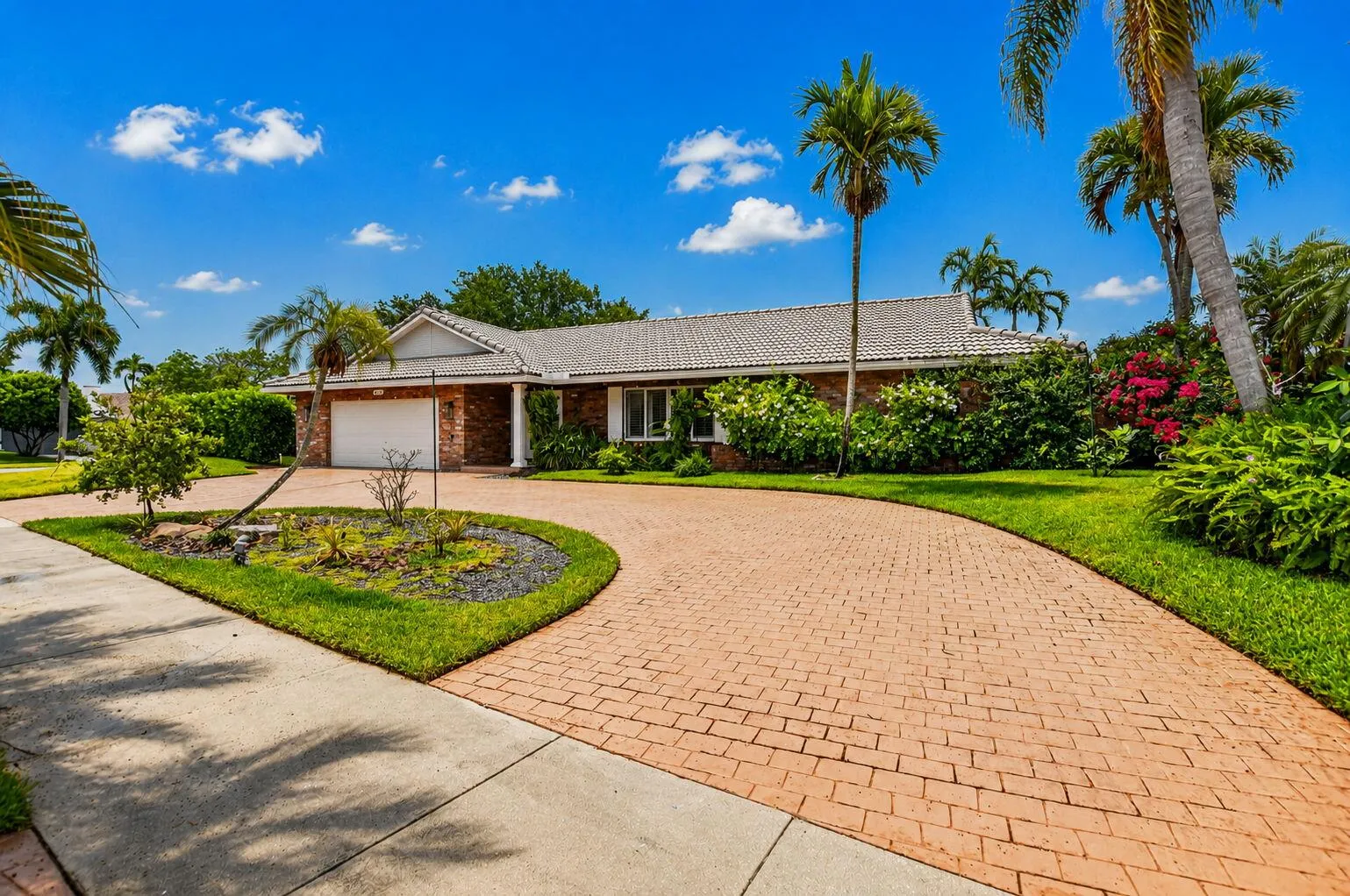 INVESTOR FRIENDLY! RENT RIGHT AWAY! Corner lot with lush lanscaping boasts a circular driveway.