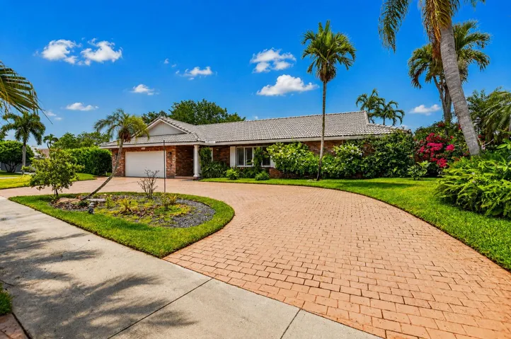INVESTOR FRIENDLY! RENT RIGHT AWAY! Corner lot with lush lanscaping boasts a circular driveway.