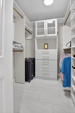 Walk-in closet #1 with buildouts-perfect for fashion fans!