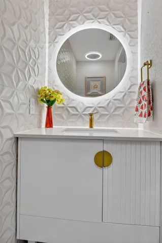 Gorgeous wallpaper! Counter height vanity.