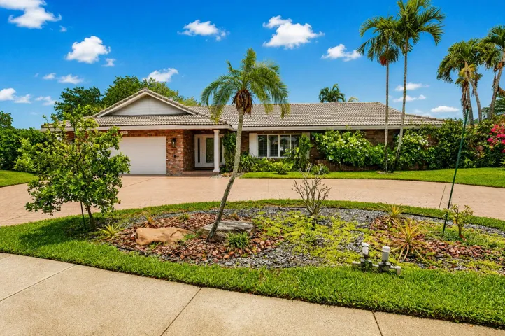 This beautifully UPDATED 3/2.5 residence offers 2,400SF of thoughtfully designed living space on a private LAKEFRONT, HUGE lot!